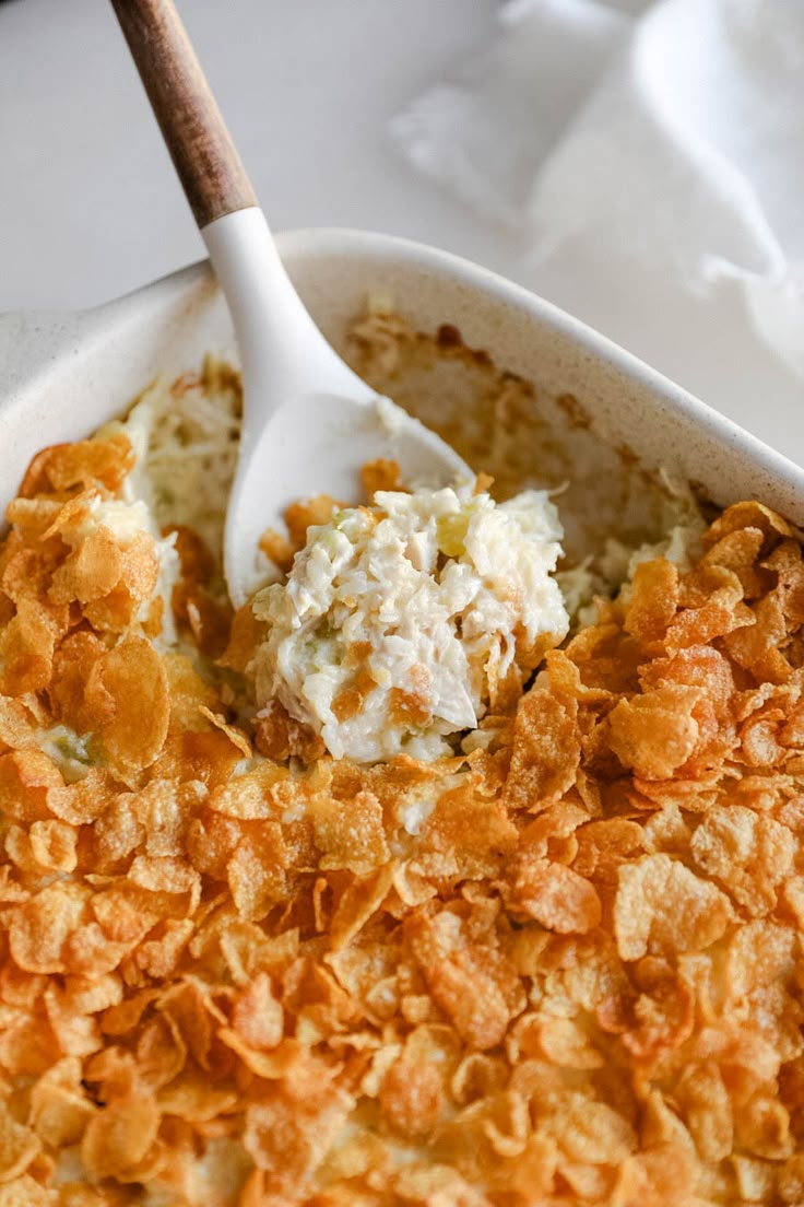 a bowl filled with cereal and cream on top of a table