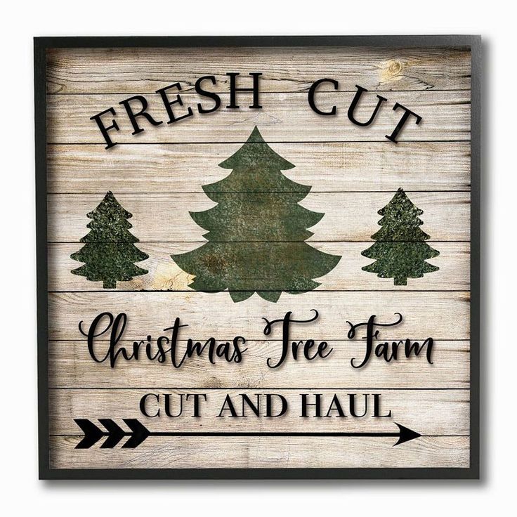 a wooden sign that says fresh cut christmas tree farm, cut and haul on it