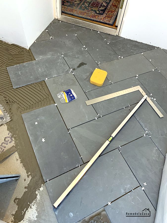 the floor is being laid out and ready to be installed in this home's entryway