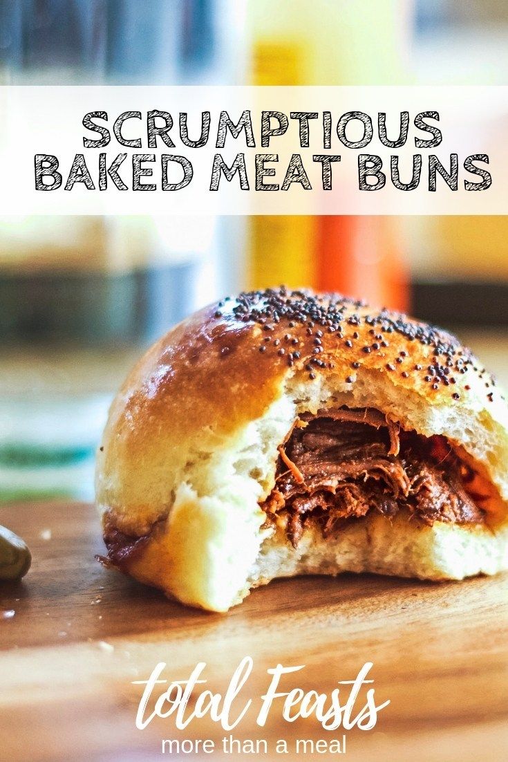 a close up of a sandwich on a cutting board with the words, scrumptious baked meat buns