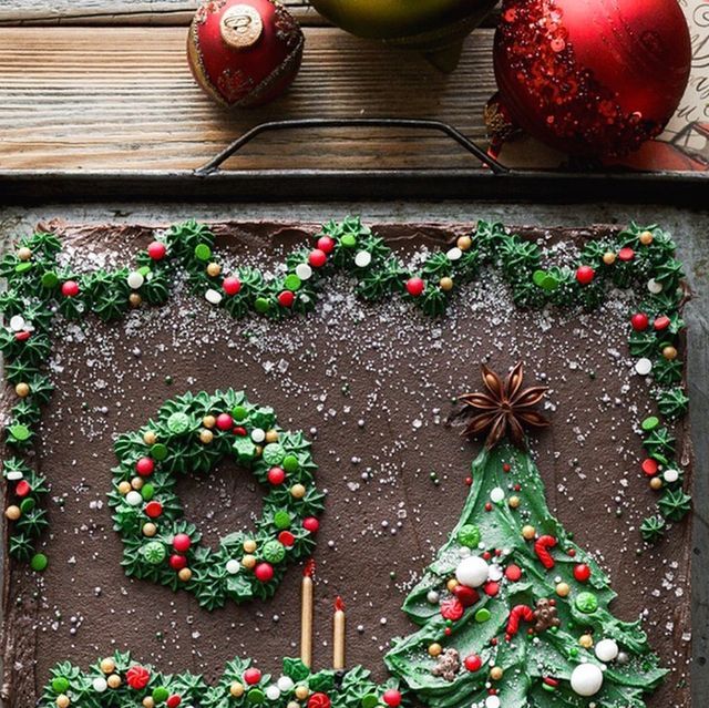 a chocolate sheet cake decorated to look like a christmas tree with the number 50 on it