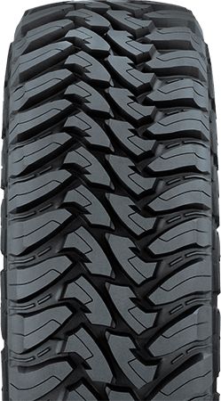 an all terrain tire on a white background