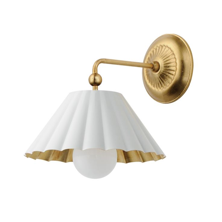 a white and gold wall light with a lamp shade on the side, against a white background