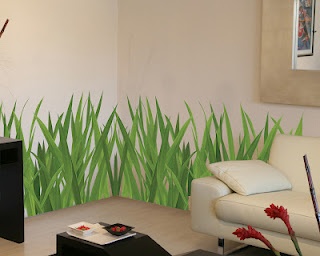 a living room with grass painted on the wall