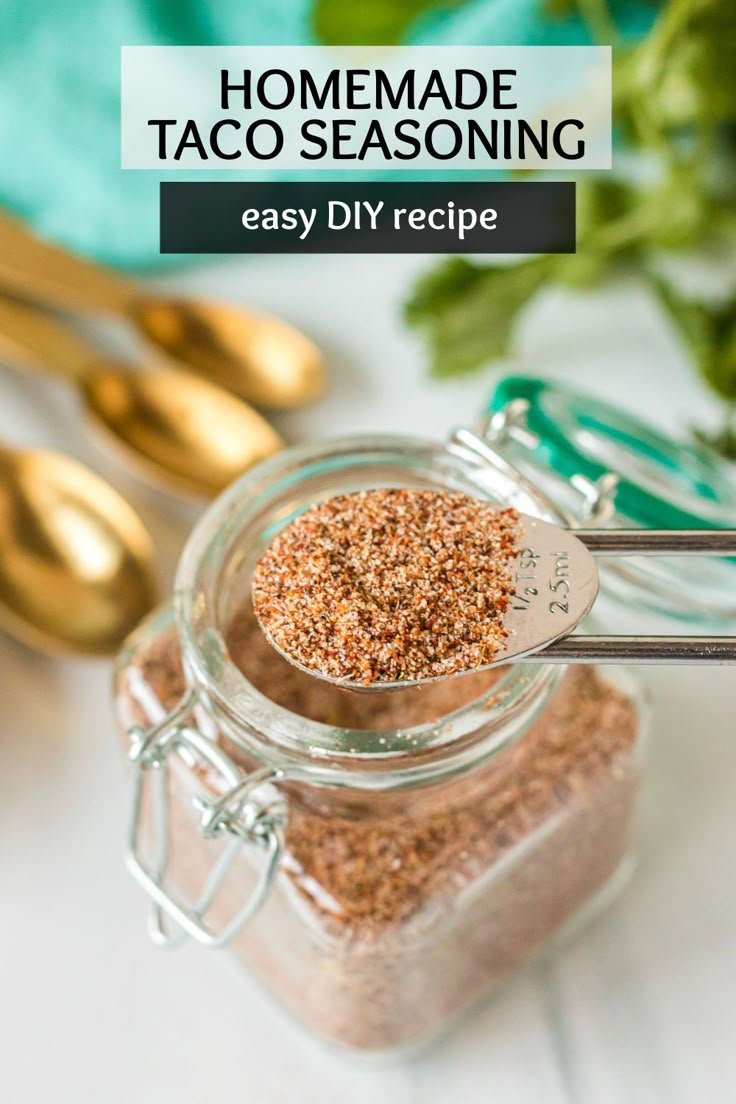 homemade taco seasoning in a glass jar with spoons