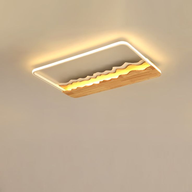 a light that is hanging from the ceiling in a room with beige walls and flooring