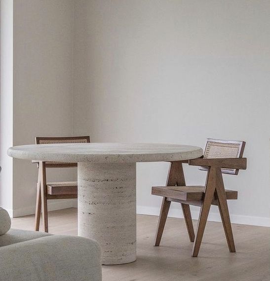 a table and two chairs in a room