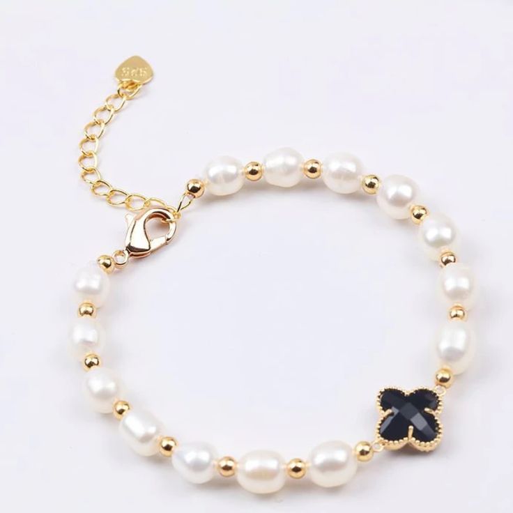 This beautiful Freshwater pearl bracelet ranges between 7-8mm in size and consists of beautiful and lustrous pearls in AAA quality. All pearls in this bracelet are round and are strung with silk thread and double-knotted between each pearl. Known as the 'icon' of cultured pearls, Freshwater pearls have graced the necks, ears, fingers, and wrists of women for decades. Huge Tomato imports their Freshwater pearls from the Freshwater rs of Japan, grown in the Pinctada fucata oyster. All of our Fresh Black Pearl Bracelets With Round Beads, Black Pearl Beaded Bracelets, Elegant Black Pearl Bracelet With Round Beads, Black Pearl Bracelets As Gift, Black Pearl Bracelets For Gift, Black Pearl Bracelets For Gifts, Black Pearl Bracelet As A Gift, Elegant Pearl Jewelry, Four Leaf Clover Bracelet