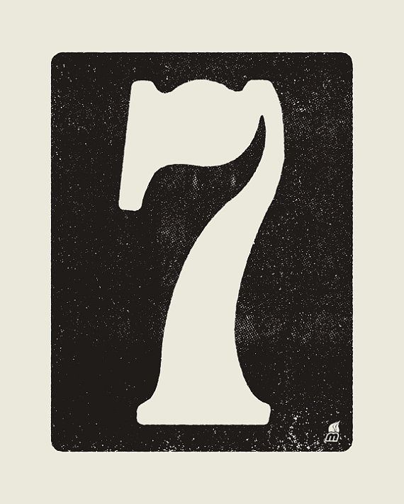 a black and white sign with the number seven on it