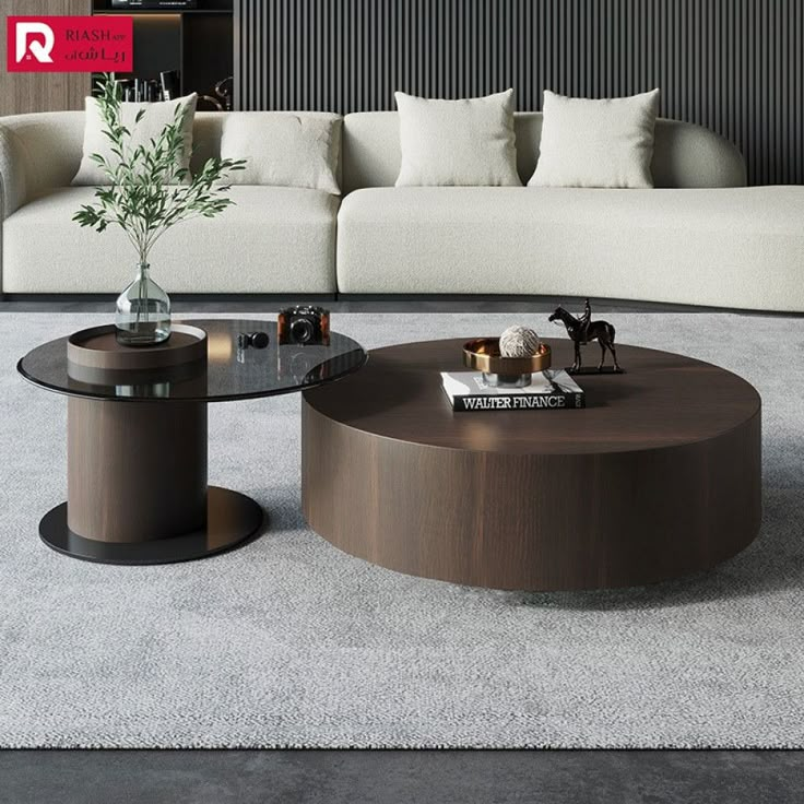 a living room filled with furniture next to a white couch and coffee table on top of a carpeted floor