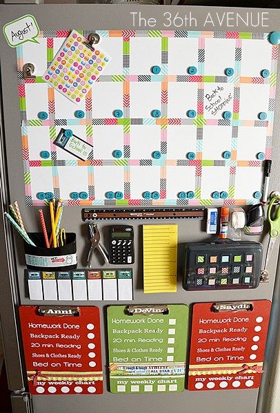 a refrigerator with magnets and papers on the front, attached to it's door