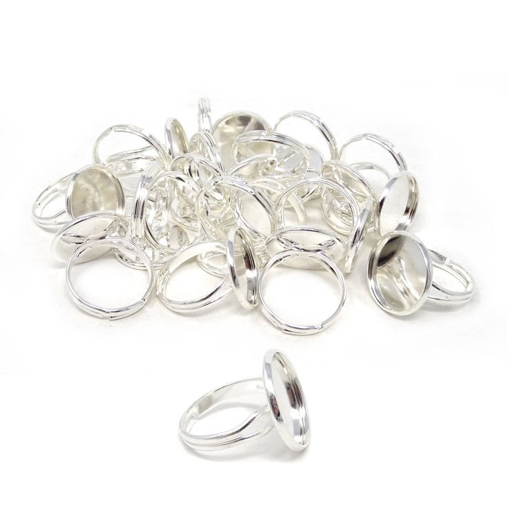 a pile of silver rings sitting next to each other