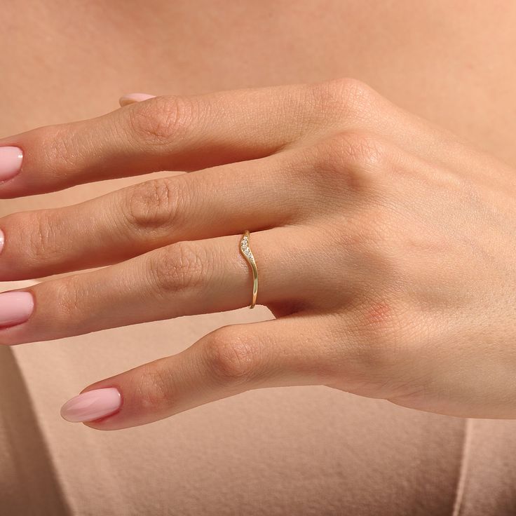 Elevate your everyday elegance with our Minimalist Diamond Curved Stacking Ring. Crafted with precision, this understated yet captivating piece features a gracefully curved design, allowing for seamless stacking with other rings. With its minimalist charm and versatile appeal, this ring will become an essential element of your personal style, effortlessly complementing any look from casual to formal. - Made in 14k Solid Gold - Decorated with handset 0.06ctw white diamond - Diamond Color and Clar Minimalist Diamond Stackable Rings, Minimalist Diamond Stackable Rings For Ladies, Elegant Stackable Diamond Ring With Open Band, Elegant Stackable Open Band Rings With Single Diamond, Elegant Stackable Open Rings With Single Diamond, Elegant Jewelry With Single Diamond On Open Band, Modern Twist Open Band Diamond Ring, Elegant White Gold Diamond Midi Rings, Elegant Stackable Midi Rings For Anniversary