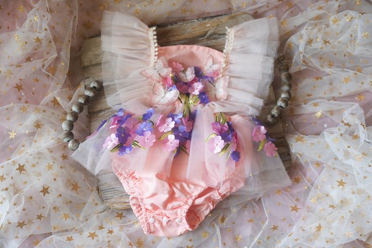 This is a listing for a romper/dress decorated with tulle ruffles, flowers and butterflies.  Sizes: 12 m             Ready to ship! All used materials are new. All items are made with care in a smoke/pet free environment. I would like to invite you to Your Dream Pix LLC VIP customers group!  Please, join us for all news and updates from my shop, new products, SALES and discounts.  https://www.facebook.com/groups/550907811777869/ Thank you! Cute Fairy Dress For Summer Garden Party, Playful Pink Fairy Dress For Summer, Whimsical Spring Fairy Dress For Parties, Whimsical Fairy Dress For Spring Party, Spring Fairy Tulle Dress, Pink Tulle Fairy Dress For Summer, Spring Party Whimsical Fairy Dress, Whimsical Summer Tutu Dress With Ruffles, Whimsical Ruffled Tutu Dress For Summer