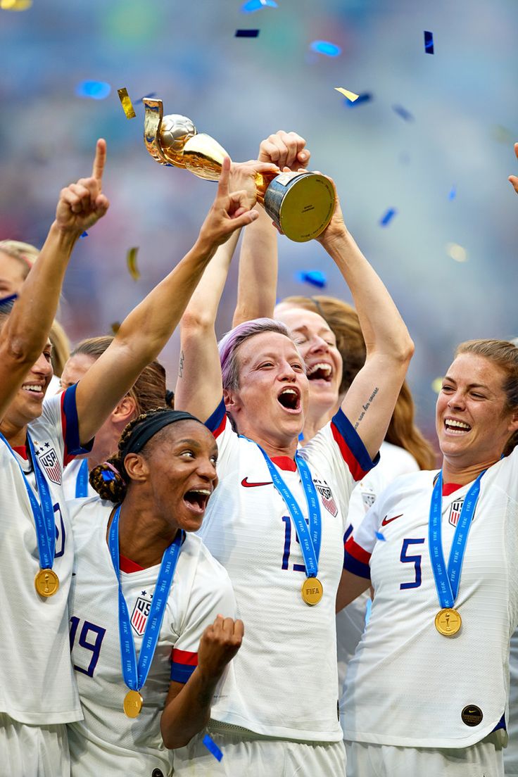 the us women's soccer team is celebrating with their trophy and confetti