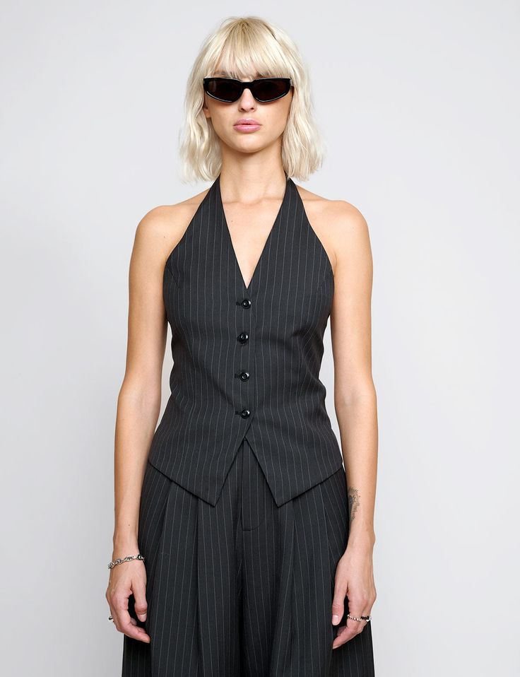 FINAL SALE Halter pinstripe button vest with fitted waist darts. Styled with matching pinstripe trousers. Brand Pixie MarketSize XS bust 32" waist 24"Size S bust 34" waist 26"Size M bust 36",waist 28"Size L bust 38", waist 30"57%Polyester 23%wool, 20% rayonLined in 100% polyesterFitted Model is wearing a size small her usual size.Imported Suit Vest For Women, Pin Stripe Vest, Pinstripe Waistcoat, Pinstripe Vest, Hoco Inspo, Stripe Vest, Pinstripe Trousers, Striped Halter Top, Halter Vest