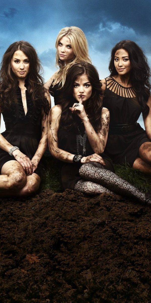 the cast of pretty little lies sitting on top of a pile of dirt with their hands in their pockets