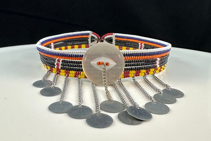 Handmade by artisans from the Maasai Tribe.  Adjustable metal closure. Metal fringe measures about 1-2" (inches) in length. Maasai beadwork is not just decorative, but a vital aspect of Maasai culture. Jewelry is made and worn to indicate age and social status as well as to mark important events. Each Color also have meaning. Maasai Culture, Culture Jewelry, Social Status, Maasai, Beaded Choker Necklace, Beaded Choker, Bead Work, Necklace Etsy, Choker Necklace