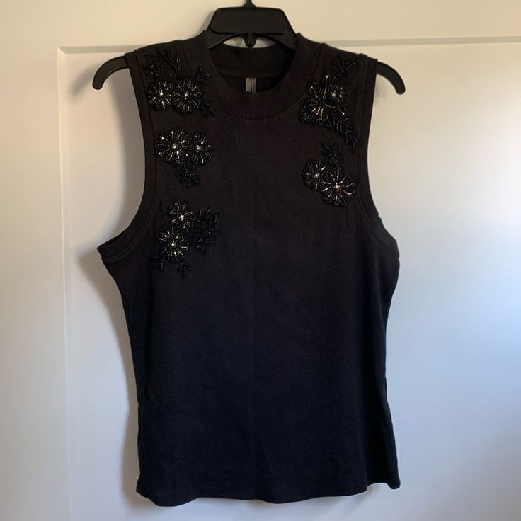 Anthropologie Beaded Appliqu Tank- Black, Size L Chic Sleeveless Embellished Tops, Black Sleeveless Embellished Tops, Black Embellished Sleeveless Tops, Sleeveless Embellished Tops For Night Out, Black Beaded Top For Night Out, Elegant Beaded Black Tops, Elegant Black Beaded Top, Stretch Embellished Black Tops, Black Stretch Embellished Tops