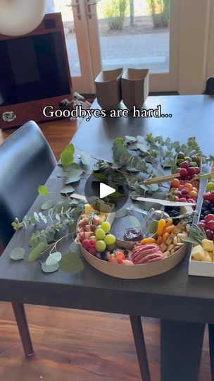 a wooden table topped with lots of different types of fruits and vegtables