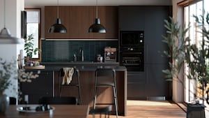 an open kitchen and dining area with bar stools