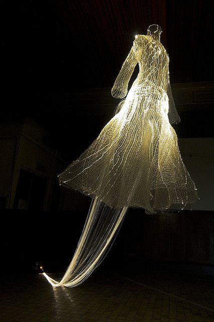 a dress made out of string and lights