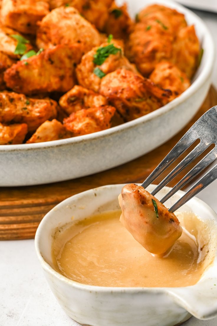 a fork in a bowl filled with soup