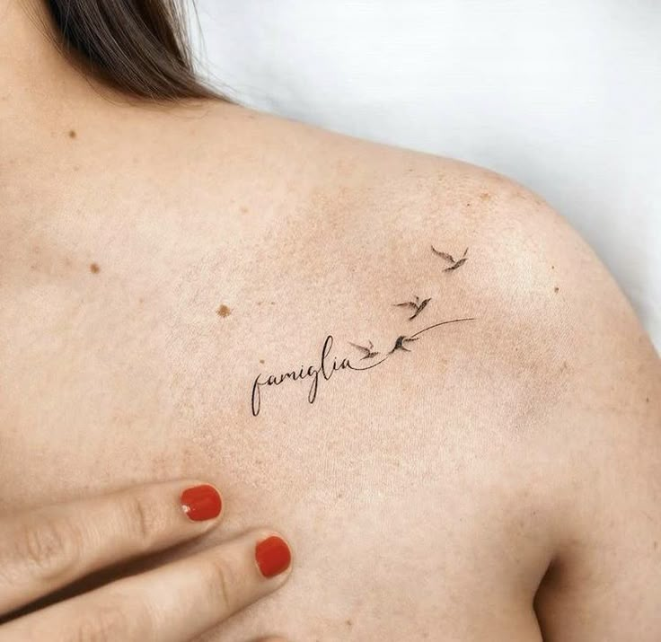 a woman's chest with the word portugal written in cursive writing on it