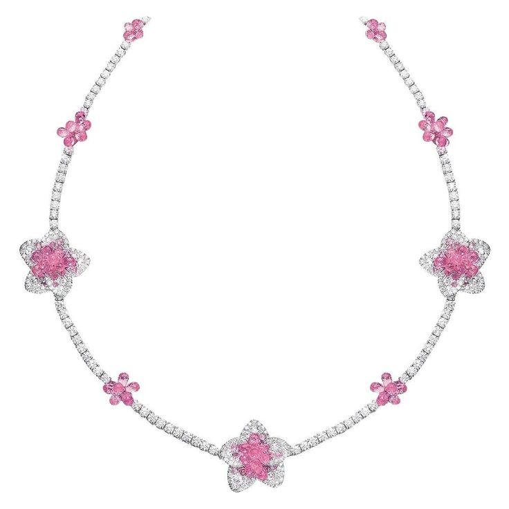 This uniquely stunning necklace is composed of 10.38 carats of round brilliant and rose-cut diamonds, and 37.55 carats of pink sapphires. The briolette cut allows the sapphires to dangle and move, allowing them to capture and reflect light at any angle. This charming necklace is the perfect combination of fun and delicate. Total length 16". Set in 18 karat white gold. Stamped Cellini Appraisal from Cellini Jewelers upon request Pink Diamond Necklace, Diamond Flower Necklace, Sapphire Diamond Necklace, Pink Diamond Jewelry, Expensive Jewelry Luxury, Jewelry Luxury, Fancy Jewellery, Expensive Jewelry, Pink Necklace