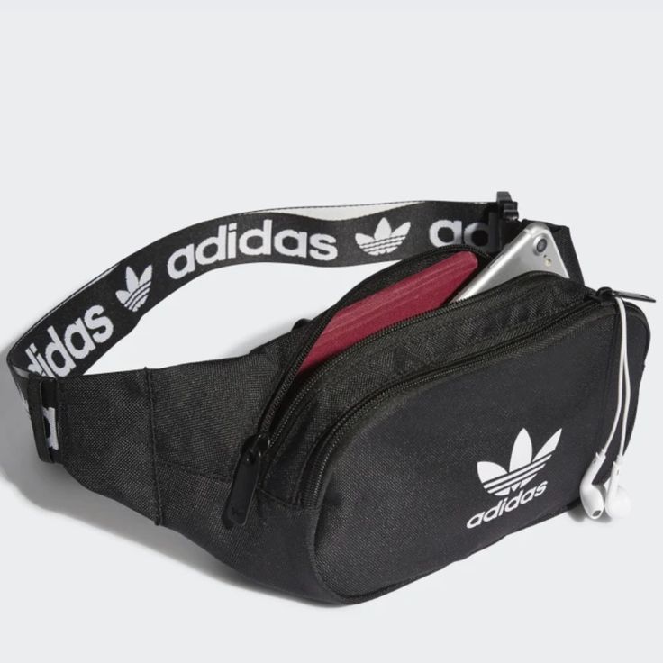 Dimensions: 2" X 14" X 4.5" Volume: 2.25 L Shell And Lining: 100% Recycled Polyester Plain Weave Two Zip Compartments Primegreen Trendy Adidas Black Bag, Trendy Black Adidas Bag, Functional Daily Use Bags With Logo, Functional Adidas Bags For On-the-go, Adidas Rectangular School Bags, Casual Bags With Logo For Daily Use, Casual Bag With Logo For Daily Use, Casual Bags With Logo, Casual Adidas Rectangular Bag