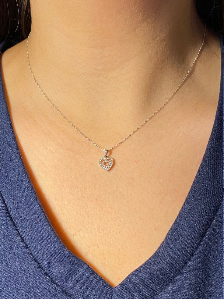 The Emely Ladies 14K Double Heart Diamond Necklace. Crafted in 14 karat white gold, this ladies necklace features a 16 inch chain with a 8.5mm double heart pendant set with diamonds. The perfect necklace to give to that special someone! The chain can be swapped for another length chain (longer or shorter) for an additional charge. Each piece has been hand selected and meticulously identified and graded by a Graduate Gemologist who has been awarded a degree by the Gemological Institute of America White Gold Sterling Silver Heart Necklace With Diamond Accents, Classic Open Heart Necklace With Diamond Accents, Elegant Double Heart Necklace With Diamond Accents, Formal Diamond White Necklace With Heart Charm, Dainty Diamond Heart Necklace With Accents, Dainty Heart Pendant White Gold Diamond Necklace, Dainty White Gold Heart Pendant Diamond Necklace, White Heart Charm Necklace For Formal Occasions, White Gold Heart Charm Necklace In Fine Jewelry Style