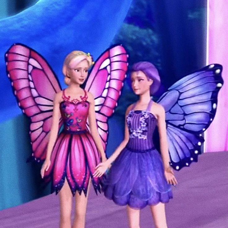 two barbie dolls standing next to each other