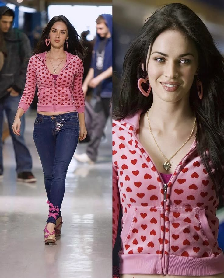 a woman in pink shirt and jeans walking down the runway