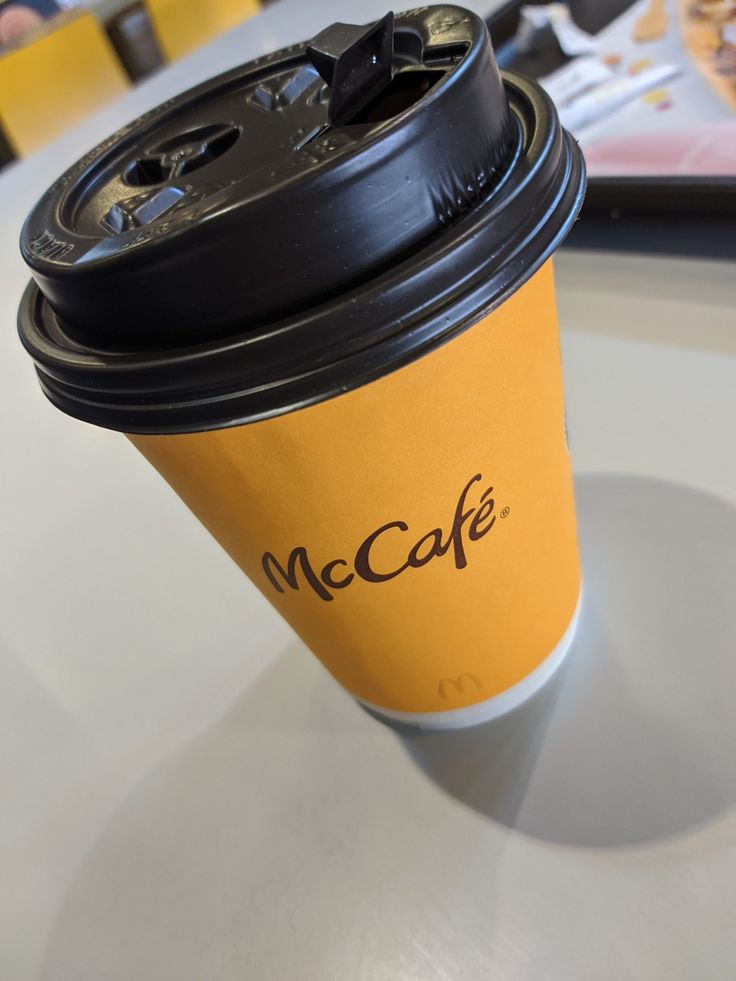 a coffee cup sitting on top of a table