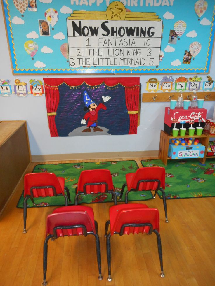 there are red chairs in front of a sign that says now showing at the lion king's birthday party