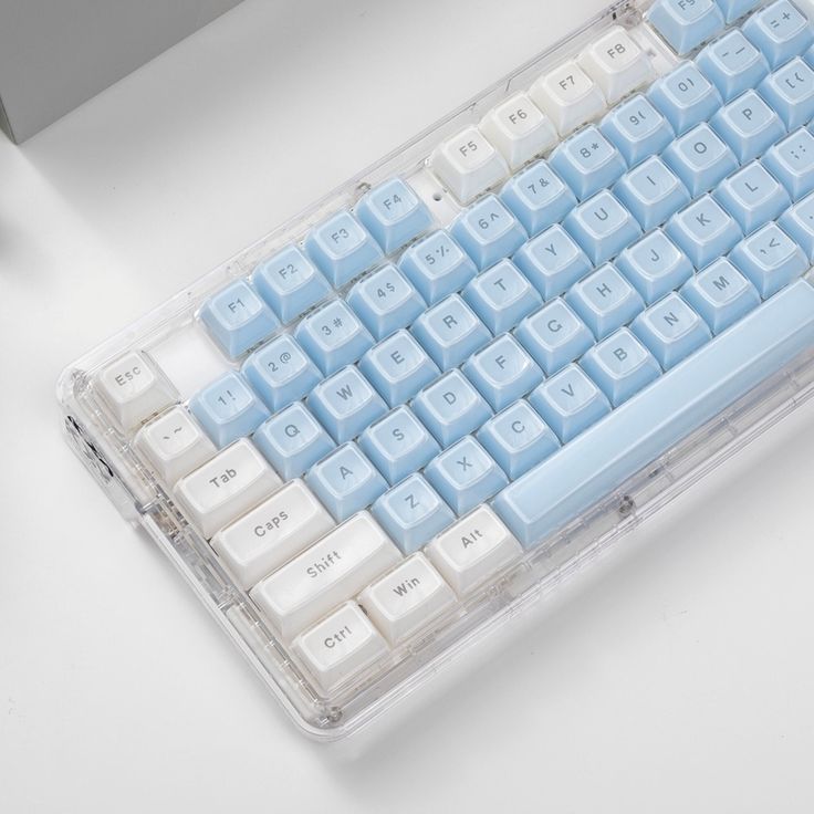 a blue and white keyboard sitting on top of a table