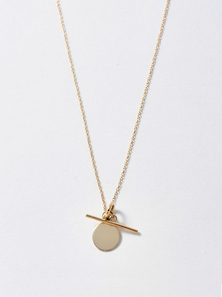 Mini Disk & Toggle Necklace Yellow Gold Toggle Necklace With Round Pendant For Gift, Yellow Gold Round Pendant Toggle Necklace, Minimalist Toggle Necklace With Round Pendant As Gift, Minimalist Round Pendant Toggle Necklace For Gift, Minimalist Yellow Gold Toggle Necklace For Gift, Minimalist Yellow Gold Toggle Necklace With Adjustable Chain, Minimalist Yellow Gold Toggle Necklace For Everyday, Minimalist Yellow Gold Toggle Necklace, Minimalist Toggle Clasp Necklace