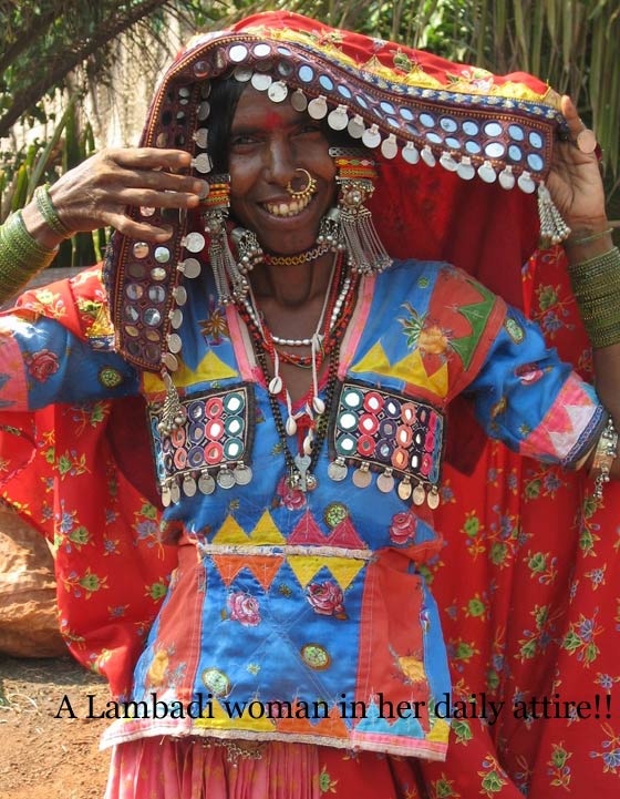 a woman in red and blue is holding her head