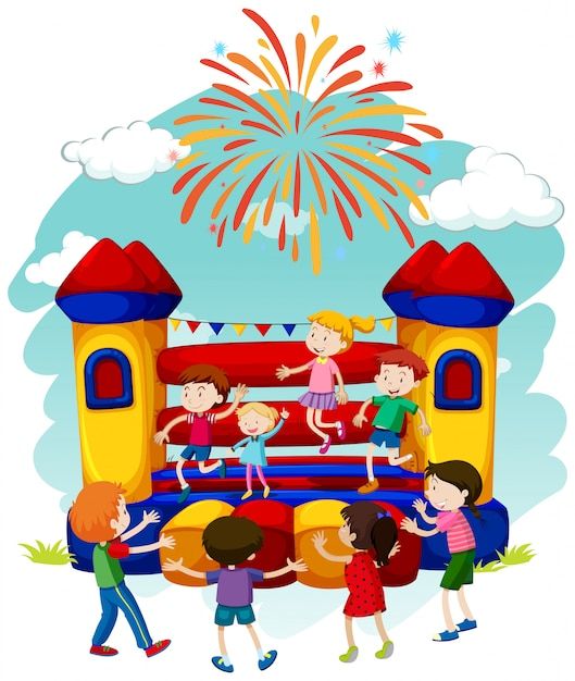 kids playing in front of a bouncy house with fireworks on the sky background