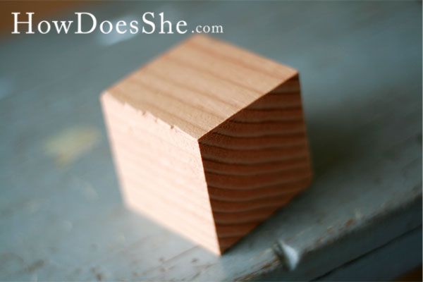 a wooden block sitting on top of a table