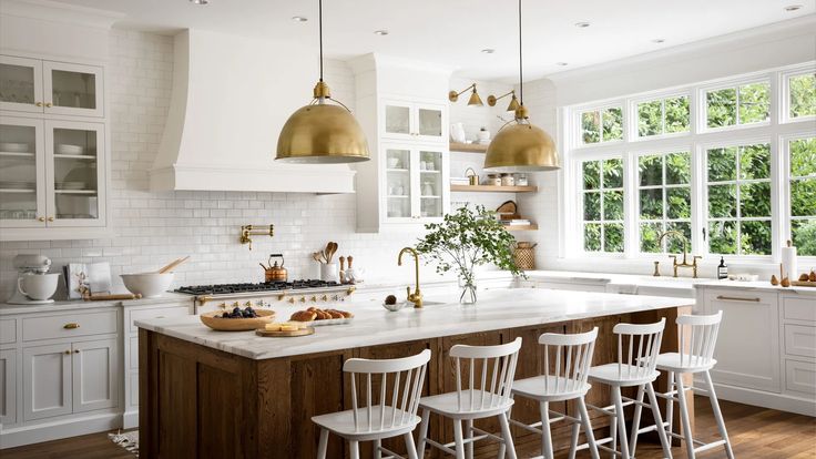 a kitchen filled with lots of white counter top space