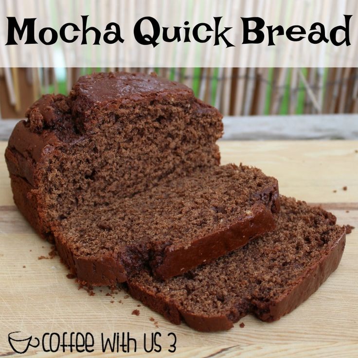 a loaf of mocha quick bread sitting on top of a wooden cutting board with the words mocha quick bread above it