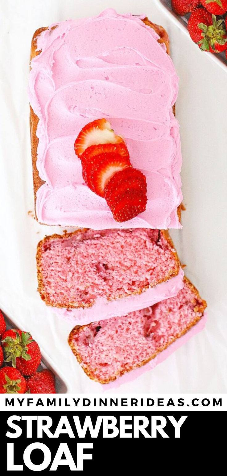 strawberry loaf cake with pink frosting and sliced strawberries on the side, sitting on a white plate