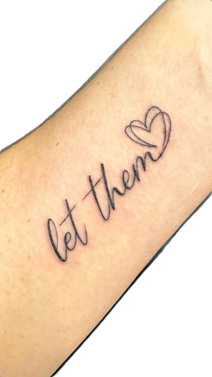 a tattoo with the word let them written in cursive font and a heart