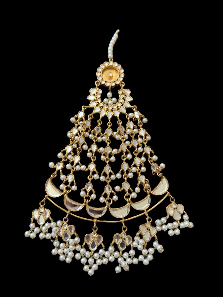 jhoomar Bridal style Made using arsi or glass kundan with 22ct gold plating Shell pearls used (faux) unless specifies our jewellery is made in semi precious stones and shell pearls . The base used is brass with 22carat gold plating . to customize in natural pearls and precious gemstones you can inbox us our jewellery unlike imitation jewellery does not tarnish or blacken . kindly wear the jewellery after application of make up . avoid contact with perfumes to maintain the longivity of jewellery. White Kundan Chandbalis With Tilla, White Kundan Chandbalis With Tilla Detail, Ceremonial Festive Kundan Necklace With Stone Work, Festive Kundan Necklace With Stone Work For Ceremonial Occasions, Ceremonial Kundan Necklace With Stone Work For Festive Occasions, Ceremonial Kundan Necklace With Stone Work For Eid, Ceremonial Chandbali Kundan Necklace With Stone Work, Festive 22k Gold Kundan Necklace With Stone Work, White Kundan Necklace With Latkans For Festive Occasion