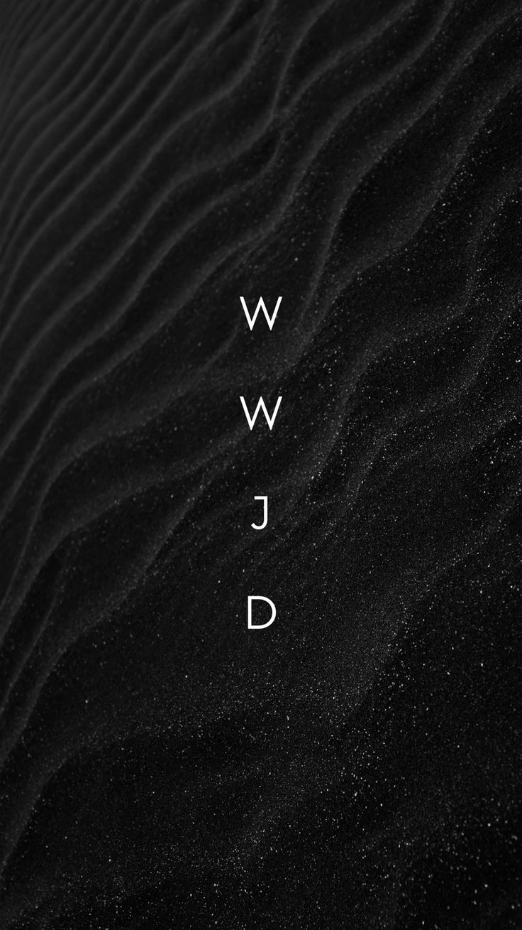 the word wwd is written in white on black sand