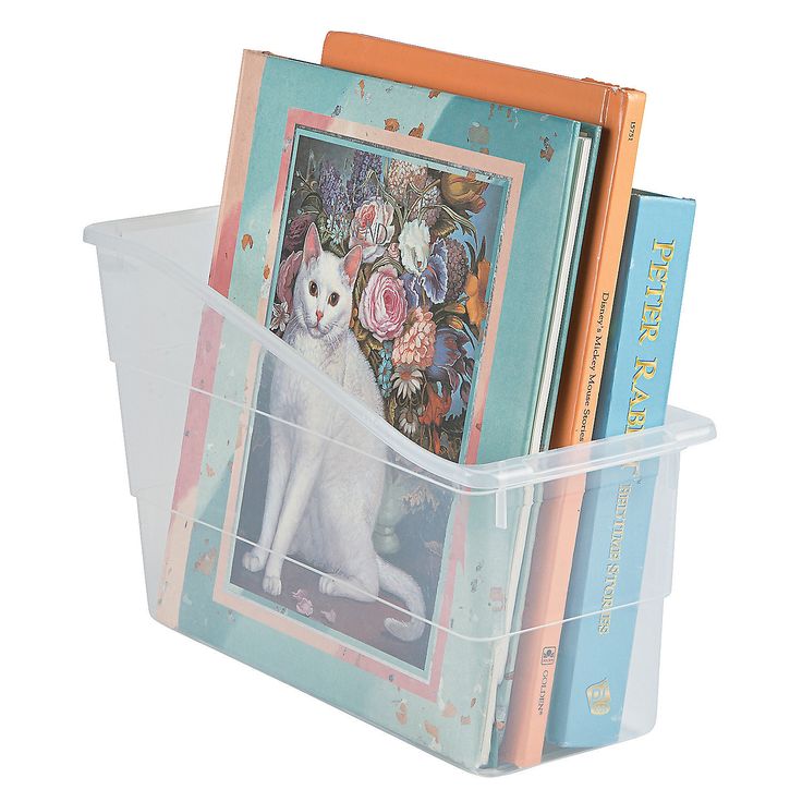 there is a plastic box with books in it and a cat on the front cover