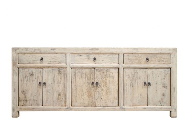 an old white wooden sideboard with four doors