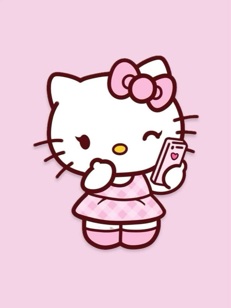 hello kitty holding a cell phone in her hand