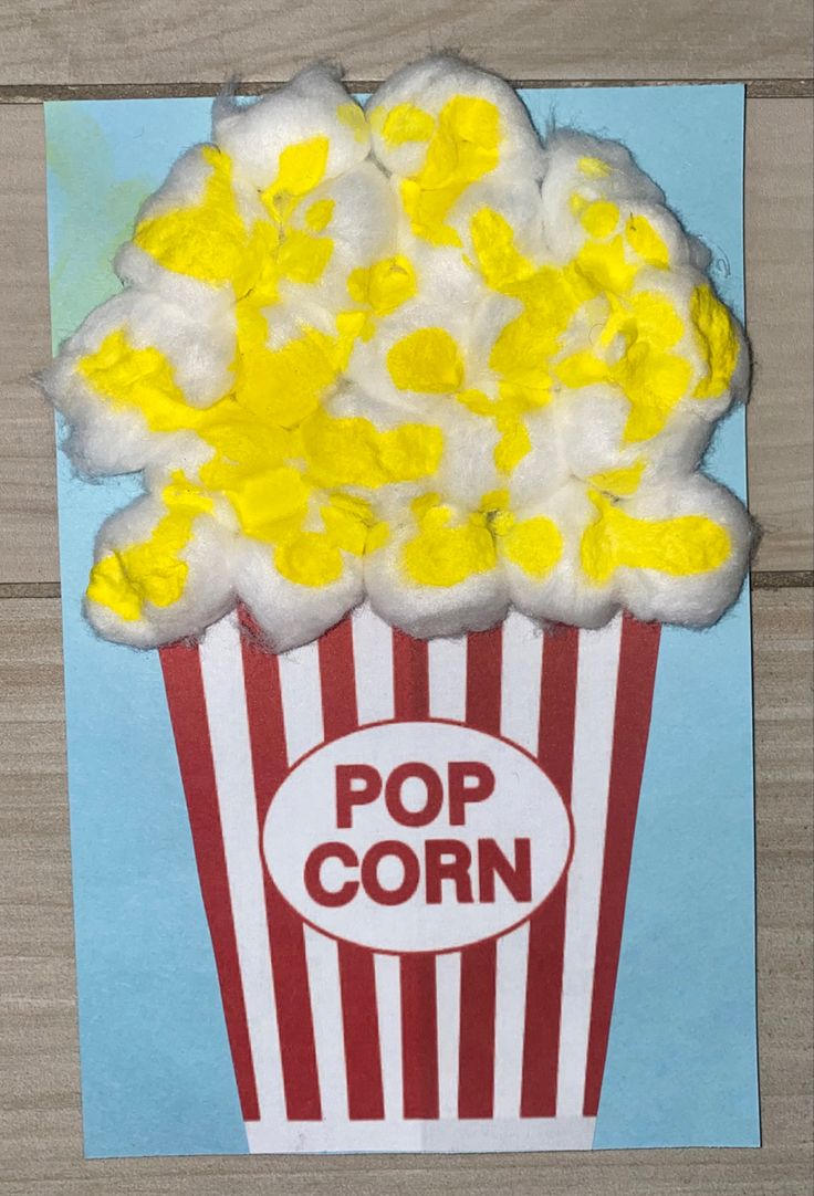 a paper bag with popcorn on it and the words pop corn written in white letters